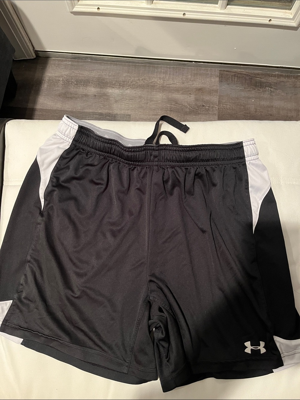 Under Armour ladies Black Athletic Shorts with White Accents